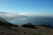 Looking south to Point Sur, visible in the finger of fog.