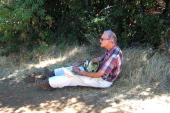 David finds a patch of shade to take a rest.