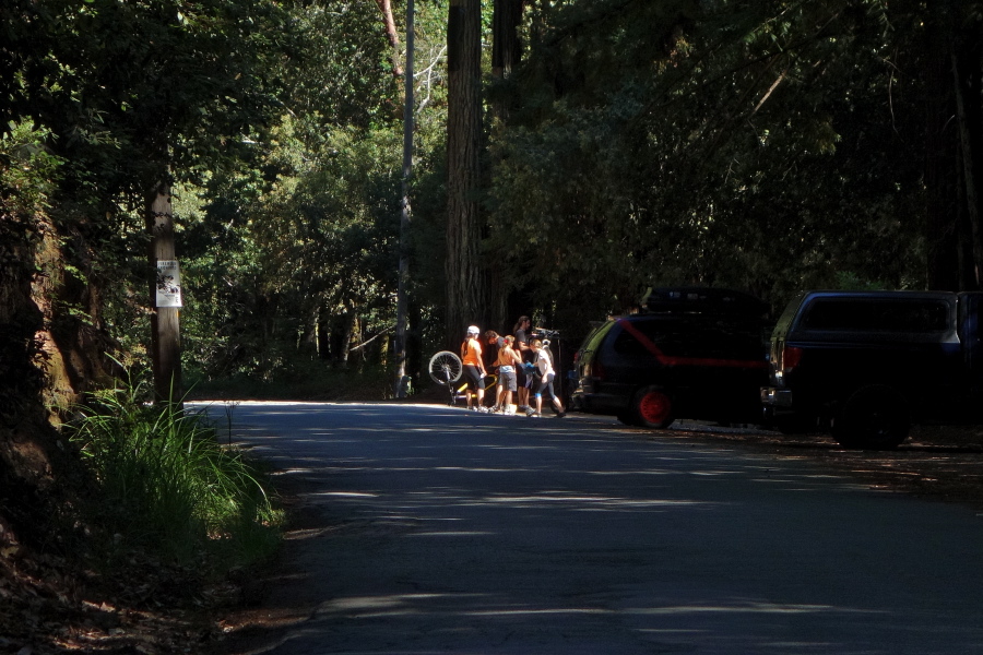 A group of cyclists at the trailhead for Soquel Demonstration Forest