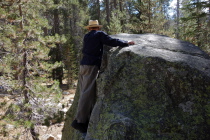 Frank looks for an easy way to surmount this boulder.