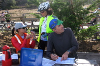 Bill checks in participants at The Bike Hut.
