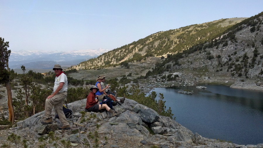 The group enjoys lunch on a rock overlooking upper Deer Lake.