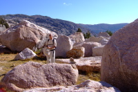 David stands amongst the granite boulders.
