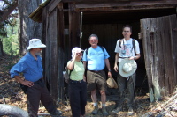 Frank, Stella, Ron, and Bill investigate the abandoned shed on the Tarwater Loop Trail.