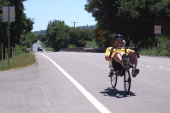 Andy rides past the San Benito County Fairgrounds on CA25