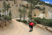 Ron rides past more mine tailings on Clear Creek Rd. (3060ft)