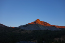 Sunset and Moonrise over a pinnacle on Mt. Dana