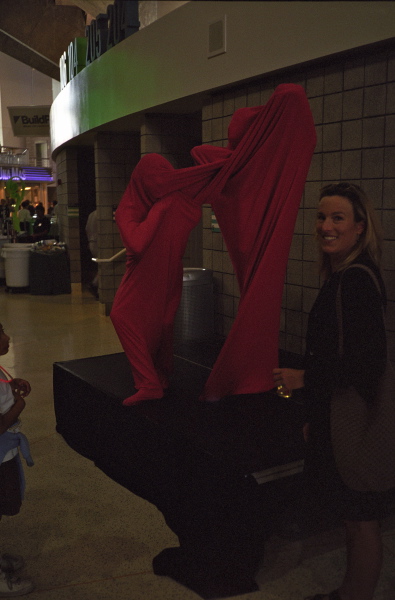 Laura enjoys the living sock sculpture.