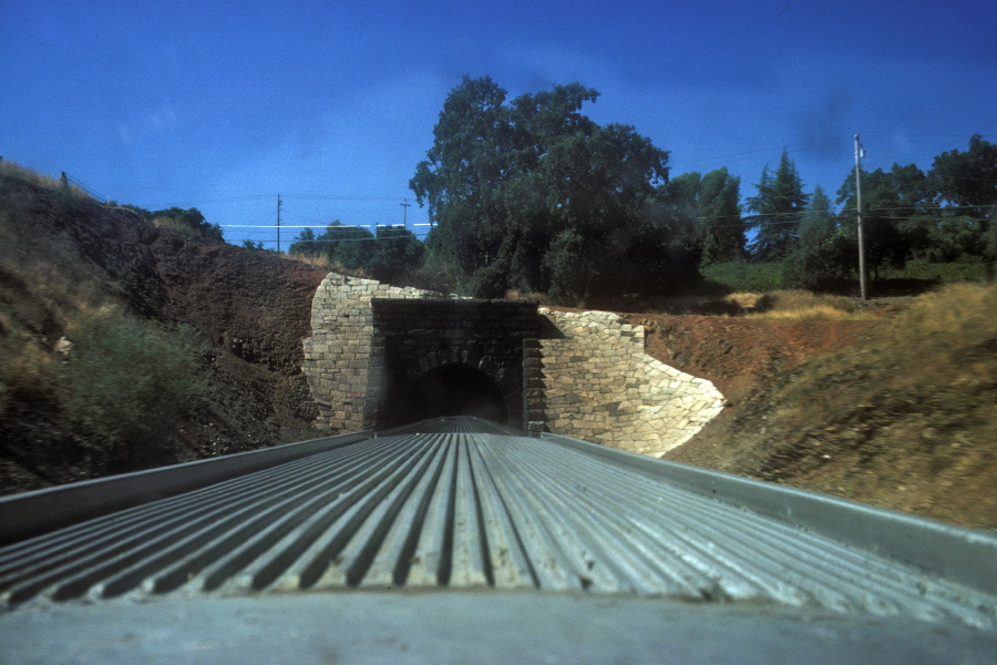 Passing into one of many tunnels near Colfax.