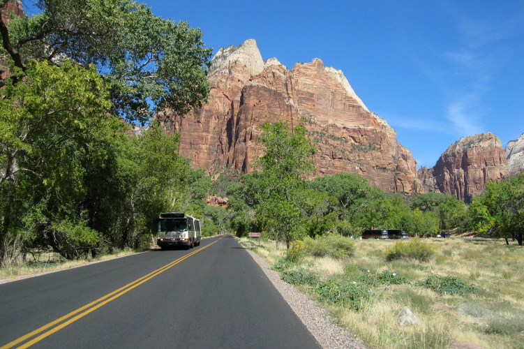 One of Zion's diesel-electric hybrid shuttle buses near the Zion Lodge.