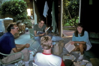 David, Bill, Laura, and Chris (back to camera) go through old stuff in the garage.
