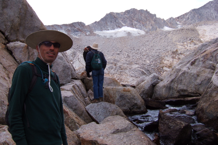 Bill and some other hikers climb along the outlet of the upper Conness Lake.