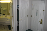 Hotel room at La Quinta Inn, entrance and bathroom