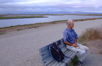 David resting on bench along the Charleston Slough trail.