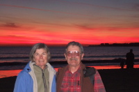 Alice and Ron enjoy the sunset on Seacliff State Beach.