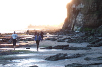Returning beneath the cliffs during low tide.