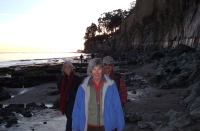 Kay, Alice, and Ron beneath the cliffs.