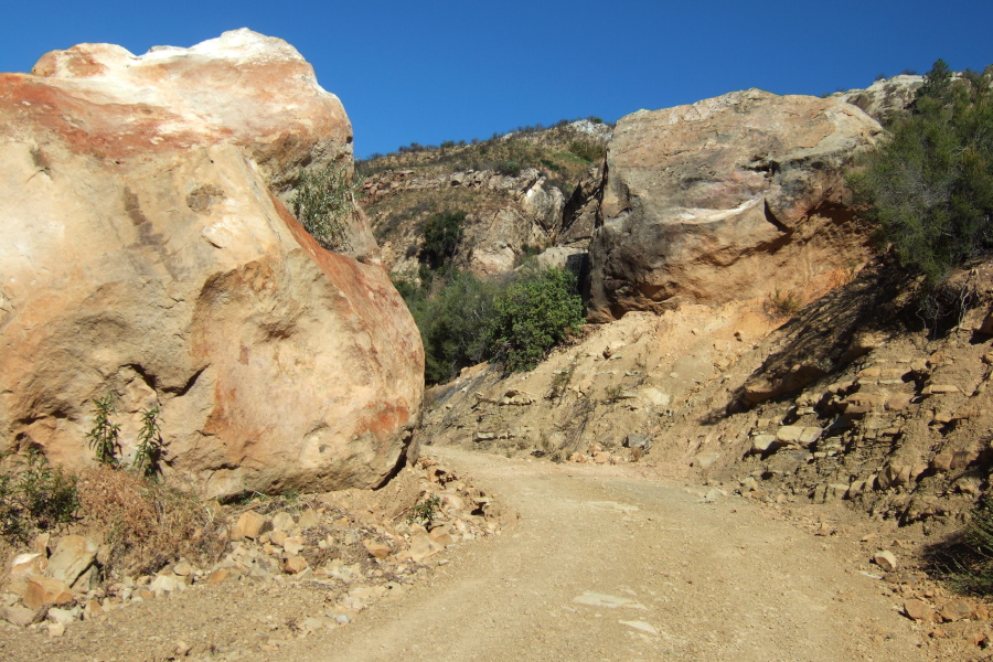 Indians Rd. passes between two large sandstone rocks.