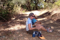 Alice and Ron rest in the shade near the power lines.