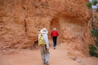 David and Kay passing through a tunnel in the rock on the Queen's Garden Trail, Bryce Canyon.
