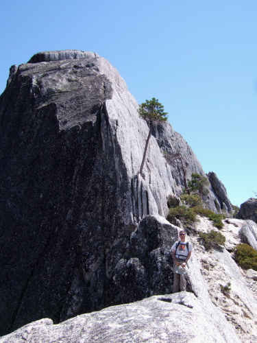 Bill stands on the other end of the ledge.