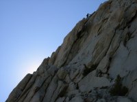 Climber nearing the top of the southeast buttress of Cathedral Peak.
