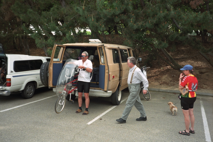 Ron Bobb and Luke Howe (middle) load bikes into the back of Willie Van Brown.