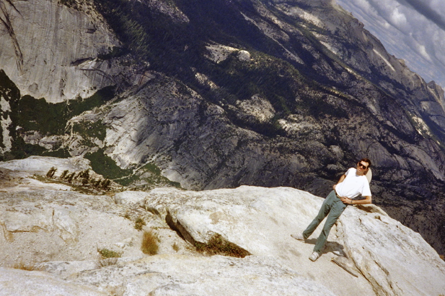 Bill on the edge; view is into Tenaya Canyon.