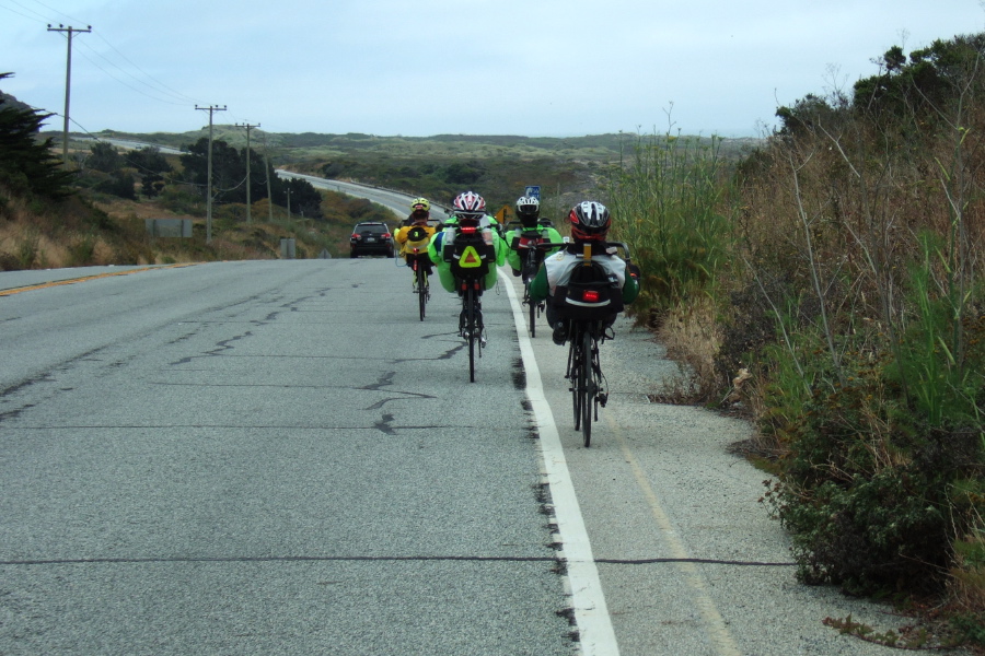 The high-racer bunch rides past Gazos Creek Beach.