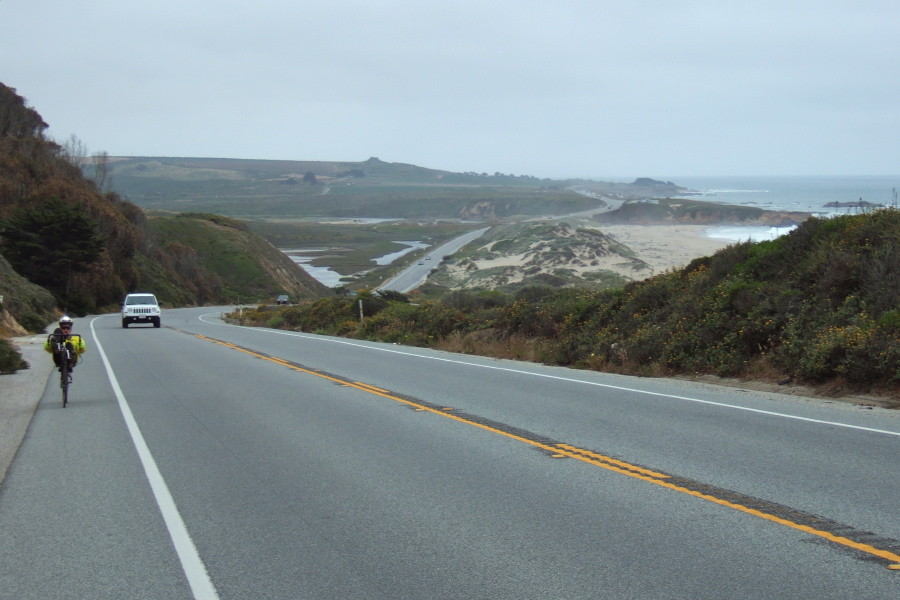 Zach climbs the hill north of Pescadero Beach.