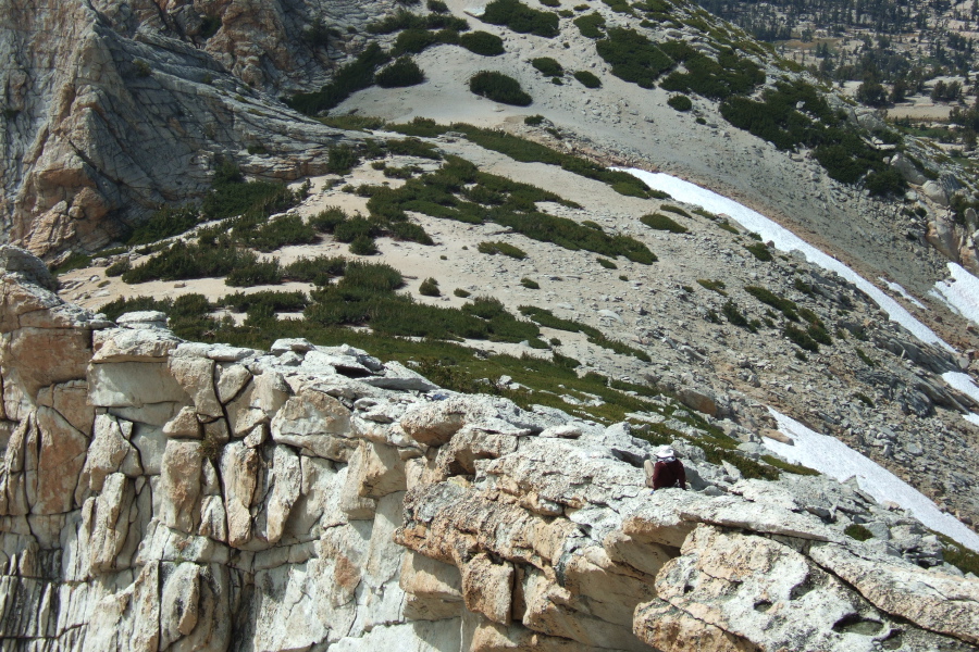 Frank has had enough vertigo and scoots down the narrow ridge.