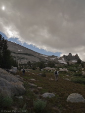 Stella, David, and Bill press on toward Echo Peaks under a swirling cloud.