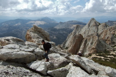 Stella climbs the rocks near the top of Echo Ridge; Frank takes photo below.