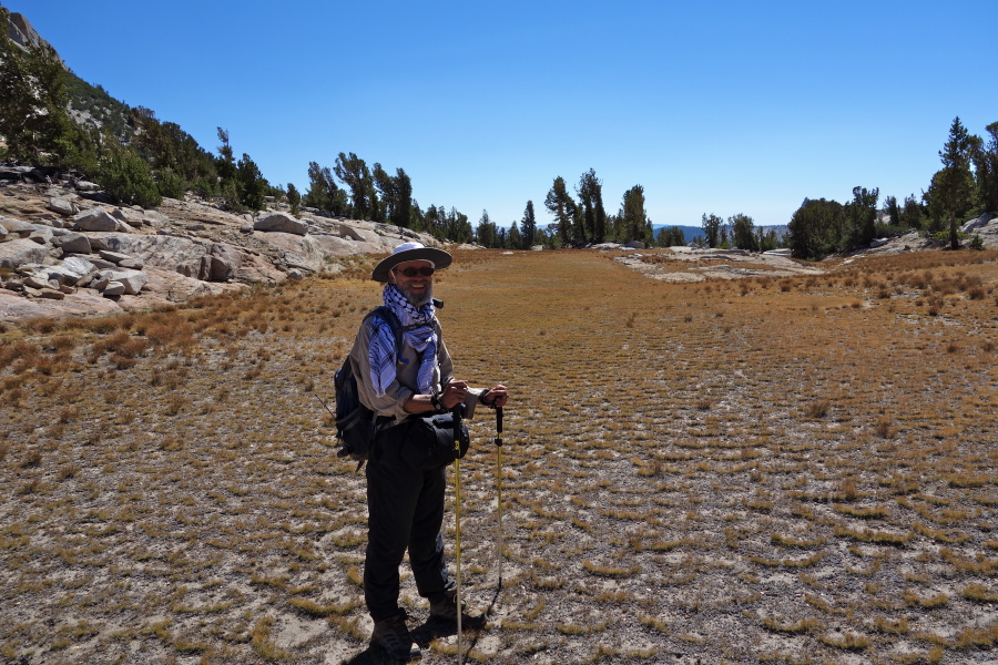 We crossed a broad meadow high on the ridge.