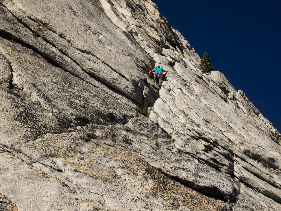 The lead climber follows a crack on the first pitch.