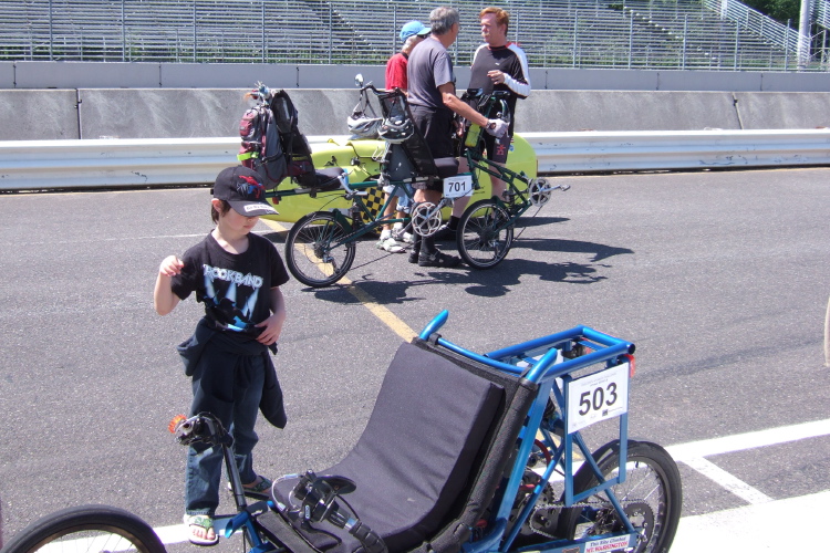 A small spectator examines Josh Kerson's drag-racing trike.