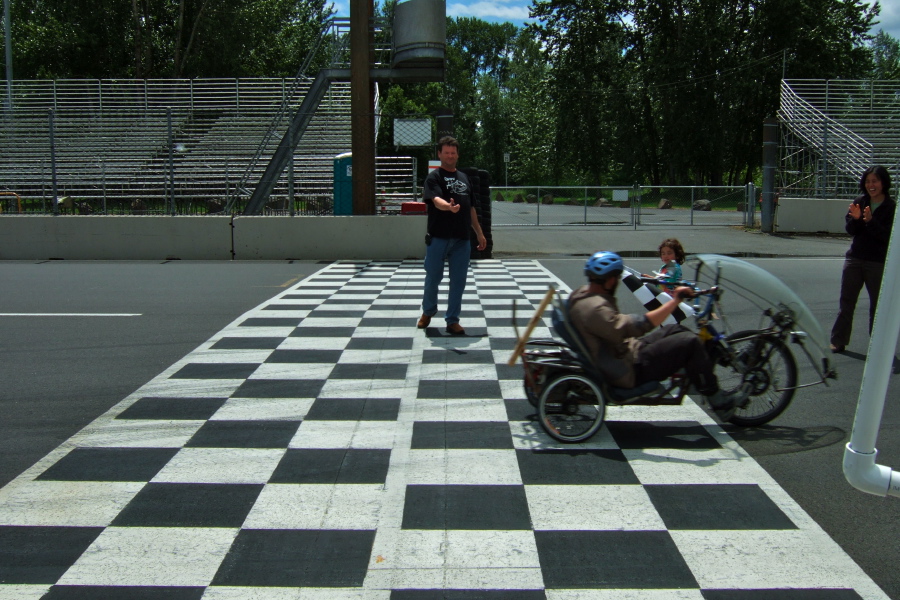 Michael Reiss finishes his last lap and is welcomed by his wife and son.