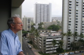 Dad enjoys the balmy tradewinds from the balcony.