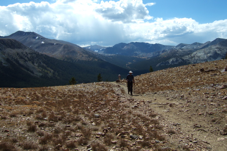 Frank reaches the top of the ridge.