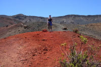 Laura on some red rock at Ka Lu'u o ka 'O'o crater.