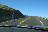 A cycle tour descends from the summit.