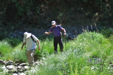 David and Bill P. cross through the creekbed of Coyote Creek.