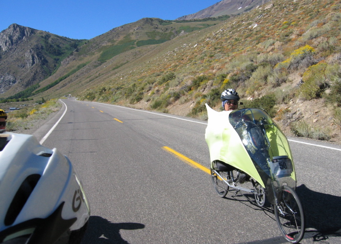 Ron Bobb riding north on June Lake Loop below the flanks of Mt. Wood (12657ft; summit out of picture)