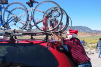 Lee gets the bike securely fastened to the rack.