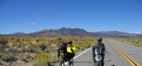 Zach and Ron ride through Adobe Valley, CA120 east.  (6630ft)