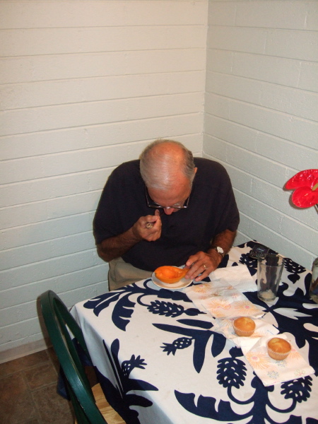 David enjoys his morning papaya in our small kitchen.