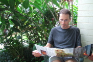 Bill studies the map of Volcanoes National Park on the lanai.