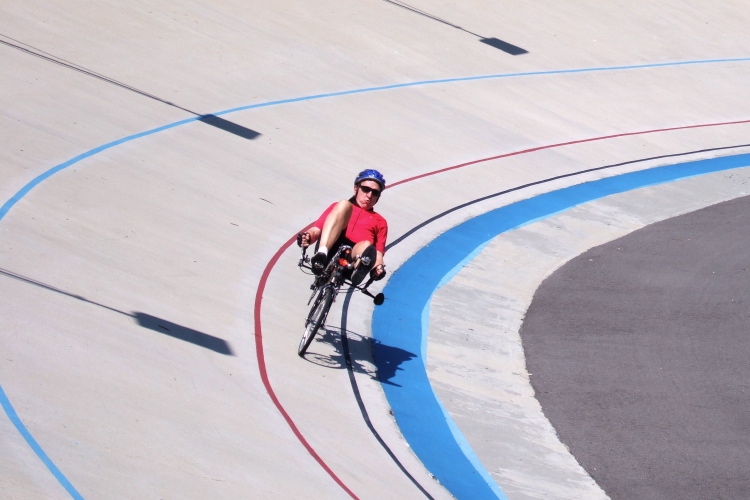 Andrew Bell sprints around the final turn.