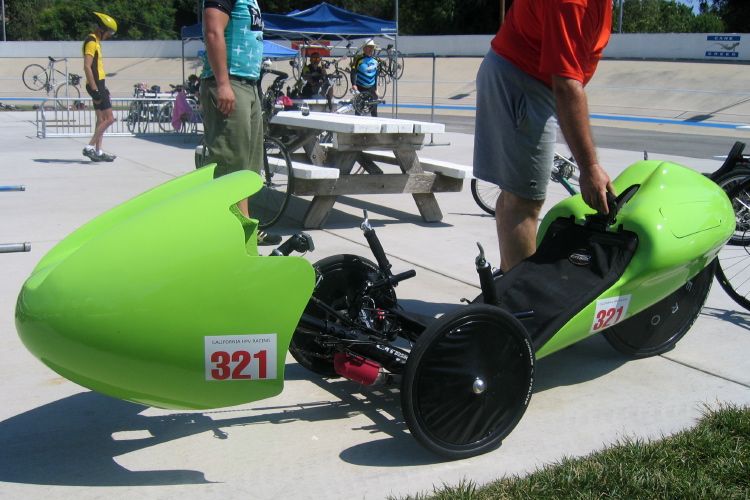 Catrike with green fairings.