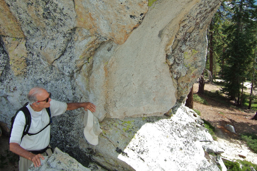 David climbs high enough to look through Indian Arch.